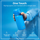 A blue water bottle is held; its flip top opens one-handed. The bottle is displayed against a light-blue background.