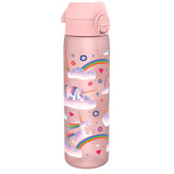 A pink water bottle, featuring unicorns and rainbows, sits on a white background.