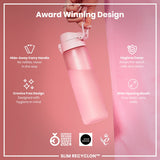 A pink water bottle is being held; it features a hide-away handle, hygiene cover, and wide mouth. The bottle is award-winning, designed for hygiene, and easy to clean and refill. GERMAN DESIGN AWARD WINNER 2024, GOOD DESIGN, and 2021 logos are present.